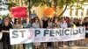 People protest against domestic violence in Mostar, Bosnia-Herzegovina, on August 14 following a triple murder in Gradacac.