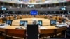 Ukrainian President Volodymyr Zelenskiy (onscreen) addresses the European Council in Brussels on December 14.
