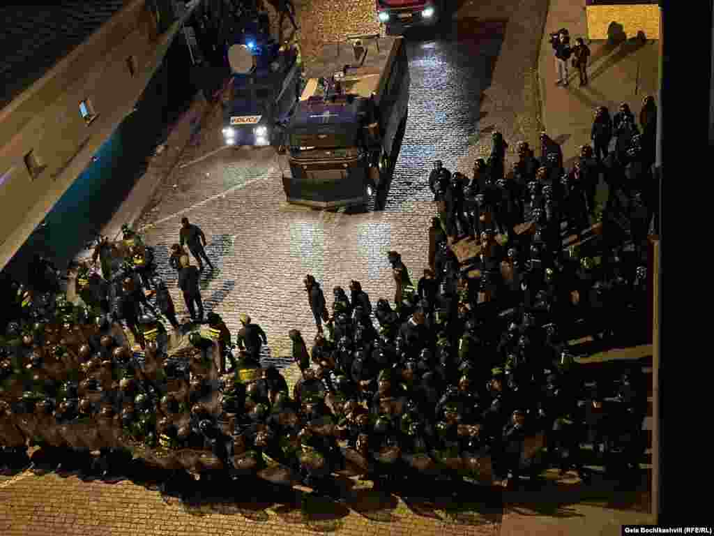 Georgian police and vehicles are seen alongside the parliament. The protests are reportedly set to continue on March 8. 
