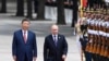 Chinese President Xi Jinpin (left) and Russian President Vladimir Putin as they review an honor guard during a visit to Beijing by the Russian leader last year. (file photo) 