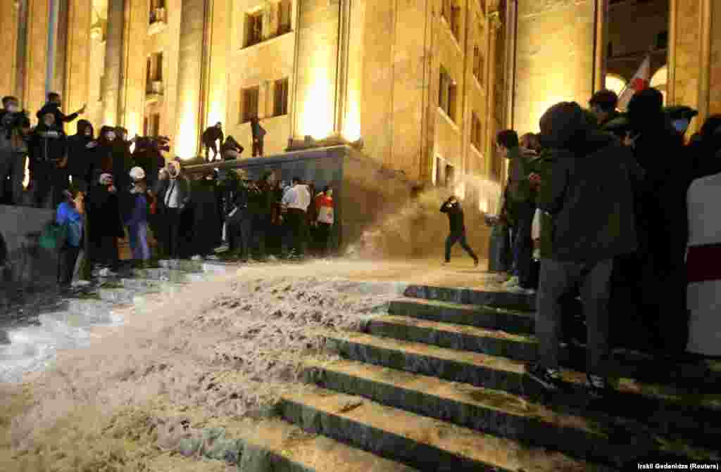 Water streams down the steps of parliament. Video from the protests showed police inside the the building spraying protesters with water mixed with tear gas as the crowd attempted to storm the legislature. 