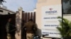 Indian police at the gates of a branch of Marion Biotech, a health-care and pharmaceutical company whose cough syrup has been linked to the deaths of children in Uzbekistan. (file photo)