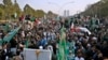 Supporters of the Pakistan Democratic Movement, an alliance of opposition parties, protest outside the head office of the Election Commission of Pakistan in Islamabad on January 19.