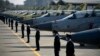Pakistani Air Force personnel stand guard in front of 14 JF-17B multirole aircraft at a ceremony in 2020.