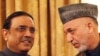 Afghan President Hamid Karzai (right), pictured meeting with his Pakistani counterpart Asif Ali Zardari, says the two countries "have a new relationship."