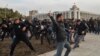 Supporters of politician Sadyr Japarov clash with supporters of former Kyrgyz President Almazbek Atambaev in Bishkek on October 9.