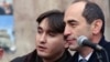 Armenia - President Robert Kocharian (R) and his senior adviser Armen Gevorgian at an election campaign rally in Yerevan, January 26, 2003.
