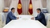 Sadyr Japarov (left) meets with President Sooronbai Jeenbekov on October 13 at his residence outside Bishkek.