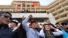 Supporters of Kyrgyz Prime Minister Sadyr Japarov attend a rally near the Ala-Archa presidential residence in Bishkek on October 15. There are suspicions that organized-crime groups are supporting Japarov.