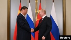 Архивска фотографија, Рускиот претседател Владимир Путин и кинескиот претседател Си Џинпинг присуствуваат на состанок на маргините на самитот на Шангајската организација за соработка (ШОС) во Астана, Казахстан, 3 јули 2024 година