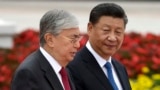 Qasym-Zhomart Toqaev (left) and Xi Jinping meet in Beijing in 2019.