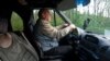 Oleksandr, a volunteer driver, travels to the Ukrainian village of Horsk near the Russian border to collect locals. He ferries people to larger towns so they can access health services and shops.