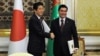 Turkmen President Gurbanguly Berdymukhamedov (right) shakes hands with Japanese Prime Minister Shinzo Abe following their meeting in Ashgabat on October 23. 