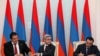 Armenia - President Serzh Sarkisian (C), Prosperous Armenia Party leader Gagik Tsarukian (L) and Oriants Yerkir Party leader Artur Baghdasarian sign a joint declaration in Yerevan, 17Feb2011.