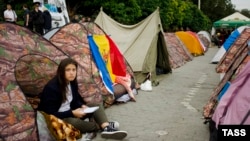 Chisinau protesters have set up about 250 tents, vowing not to go home until their demands are met.