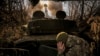 Ukrainian soldiers of the 24th Mechanized Brigade fire a 2s1 self-propelled 122mm howitzer toward Russian positions near Chasiv Yar in the Donetsk region on November 13.