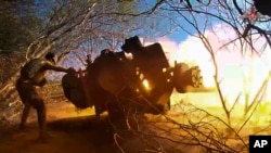 A soldier fires at a Ukrainian position in Russia's Kursk region in October. 