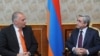 Armenia - President Serzh Sarkisian (R) meets with Axel Fischer, visiting co-rapporteur of the Council of Europe's Parliamentary Assembly, 20Jul2011.