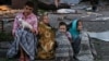 Children gather near the site of a Russian missile attack in Kyiv on August 28.