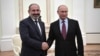 Russian President Vladimir Putin (right) hosted Armenian Prime Minister Nikol Pashinian at the Kremlin on September 8, the two leaders' third such meeting.