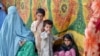 A woman and her family arrive in Peshawar after fleeing the restive Bajaur tribal area.