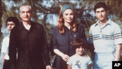 The shah of Iran (left) with his wife and sons Crown Prince Reza on right) and daughter shown during their stay in the Bahamas in April 1979.