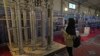 A student looks at Iran's domestically built centrifuges in an exhibition of the country's nuclear achievements in Tehran in February 2023.