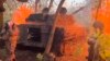 In this photo taken from a video released by the Russian Defense Ministry press service on October 30, a Russian howitzer fires toward Ukrainian positions in the Kursk border area of Russia.