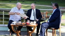 BELARUS -- Russian President Vladimir Putin (Center), Belarusian President Alyaksandr Lukashenka (Left) and Tajik President Emomali Rahmon (Right) speak during their meeting, in Minsk, Belarus, 30 June 2019