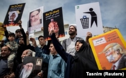 Iranians shout slogans during a protest in Tehran against U.S. President Donald Trump's decision to walk away from the nuclear deal.
