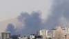 Smoke billows for the second day from the Shahran oil depot, northwest of Tehran, on June 16, 2025.