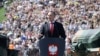 Polish President Karol Nawrocki speaks at a military parade in Warsaw on August 15.