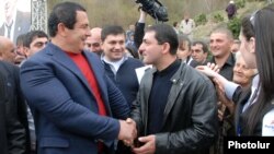 Armenia - Prosperous Armenia Party leader Gagik Tsarukian (L) campaigns in Dilijan, 17Apr2012.