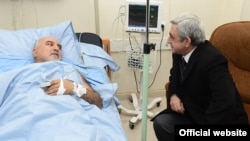 Armenia - President Serzh Sarkisian (R) visits wounded opposition presidential candidate Paruyr Hayrikian at a Yerevan hospital, 1Feb2013.