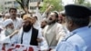 Demonstrators shout antigovernment slogans in Islamabad on July 13