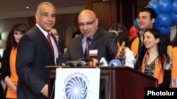 Armenia - Heritage party leader Raffi Hovannisian (L) and Free Democrats Party leader Khachatur Kokobelian announce the start of their joint election campaign, 9Apr2012.