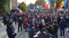 Supporters of Moldovan opposition politician Renato Usatii protest against his detention in front of the National Anticorruption Center in Chisinau on October 24. 