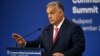 Hungarian Prime Minister Viktor Orban gestures at a press conference on November 7 ahead of the summit in Budapest. 